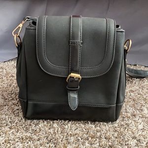 Black Vegan leather and suede cross body from Ivy & Fig w/Tri-fold compartments